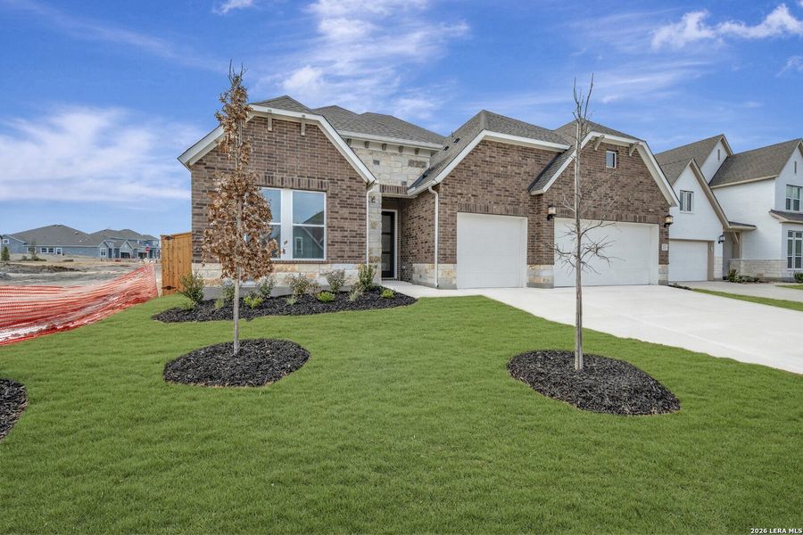 Front exterior of a new home in Briggs Ranch – Signature Legacy Series, San Antonio, TX, highlighting curb appeal (Image 2). Front exterior of a new home in Briggs Ranch – Signature Legacy Series, San Antonio, TX, highlighting curb appeal (Image 2).