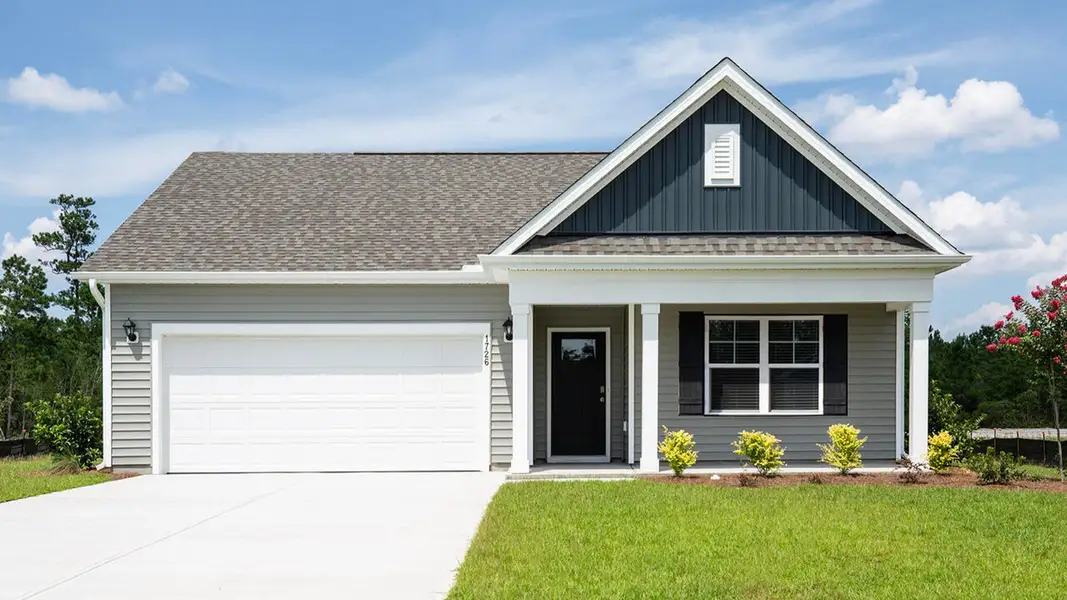 Front exterior of a new home in Sidbury Station, Castle Hayne, NC, highlighting curb appeal (Image 1). Front exterior of a new home in Sidbury Station, Castle Hayne, NC, highlighting curb appeal (Image 1).