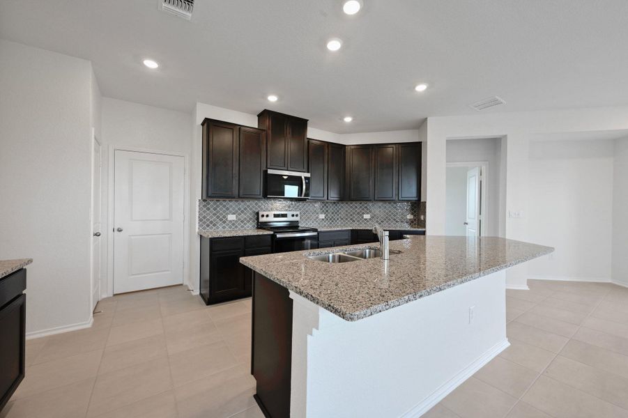 Furnished interior view inside a new home in Stoney Chase, Del Valle (Image 12).