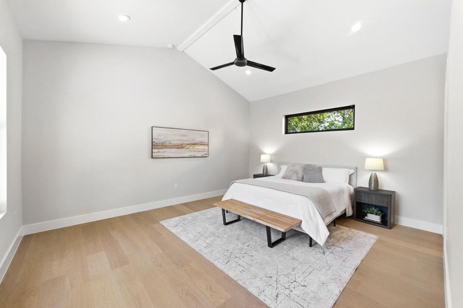 Spacious primary bedroom with vaulted ceilings Spacious primary bedroom with vaulted ceilings