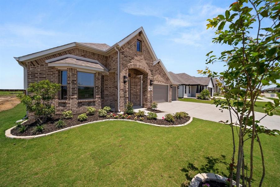 Front exterior of a new home in , Venus, TX, highlighting curb appeal (Image 24).