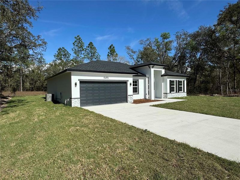 Front exterior of a new home in , Citrus Springs, FL, highlighting curb appeal (Image 18).