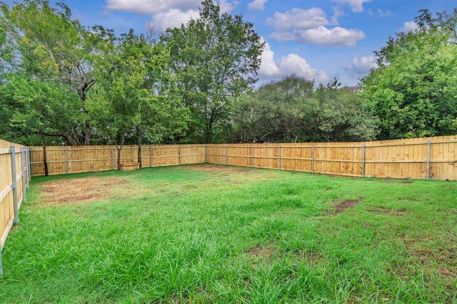 Front exterior of a new home in , Greenville, TX, highlighting curb appeal (Image 17). Front exterior of a new home in , Greenville, TX, highlighting curb appeal (Image 17).
