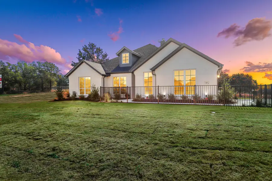 Front exterior of a new home in Arbor Oaks, Boyd, TX, highlighting curb appeal (Image 24). Front exterior of a new home in Arbor Oaks, Boyd, TX, highlighting curb appeal (Image 24).