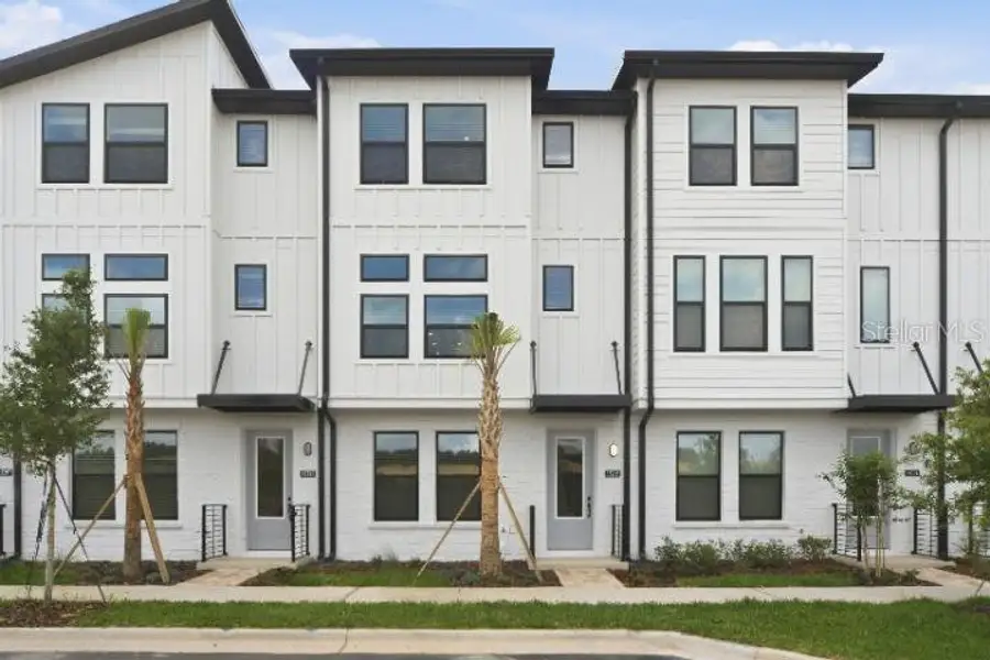 Front exterior of a new home in , Winter Garden, FL, highlighting curb appeal (Image 1). Front exterior of a new home in , Winter Garden, FL, highlighting curb appeal (Image 1).