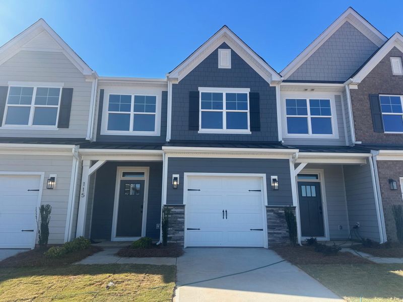 Front exterior of a new home in Blythe Mill Townhomes, Waxhaw, NC, highlighting curb appeal (Image 1). Front exterior of a new home in Blythe Mill Townhomes, Waxhaw, NC, highlighting curb appeal (Image 1).