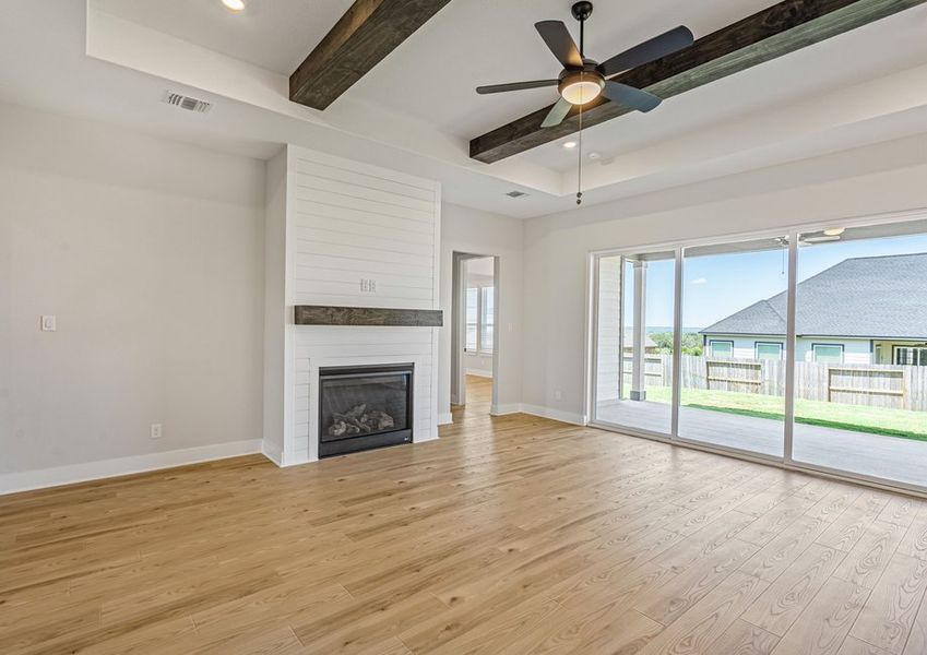 The family room has large windows that in great, natural light.