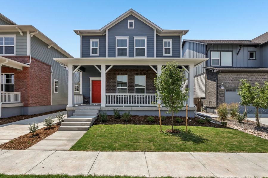 Front exterior of a new home in Painted Prairie Cottage, Aurora, CO, highlighting curb appeal (Image 1). Front exterior of a new home in Painted Prairie Cottage, Aurora, CO, highlighting curb appeal (Image 1).