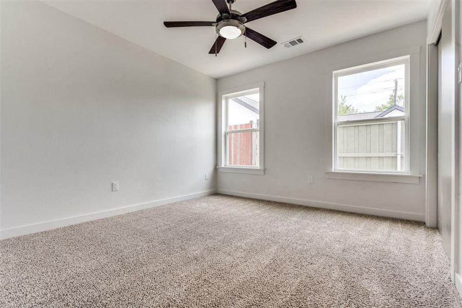 Secondary bedroom with high ceilings and total privacy.