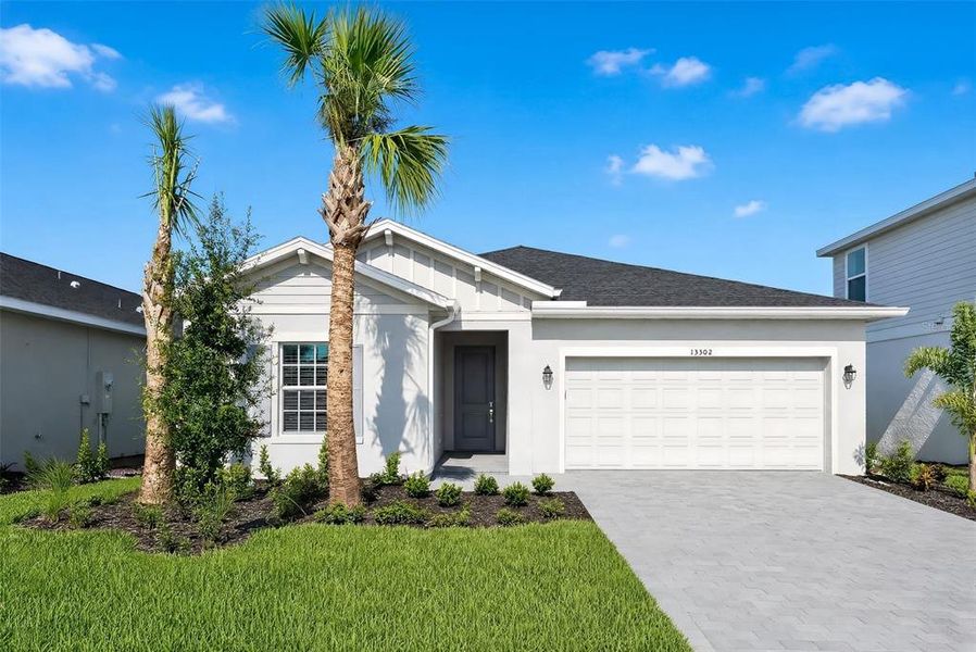 Front exterior of a new home in Lennar at Turnleaf, Punta Gorda, FL, highlighting curb appeal (Image 1). Front exterior of a new home in Lennar at Turnleaf, Punta Gorda, FL, highlighting curb appeal (Image 1).