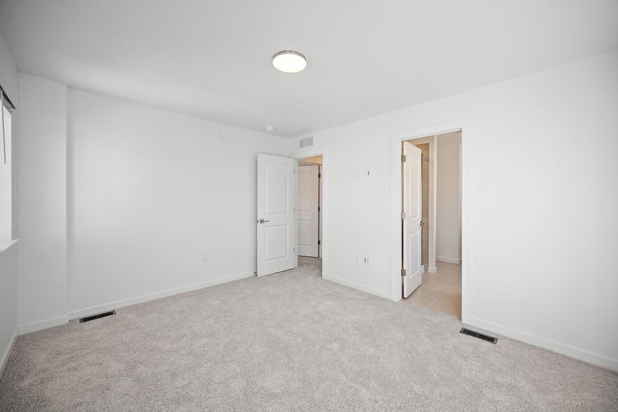 Spacious, unfurnished interior of a new home in Lyric at RidgeGate Townhomes, Lone Tree (Image 21).