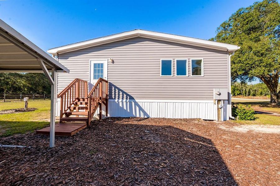 Exterior details and patio area of a home in , Morriston (Image 25).