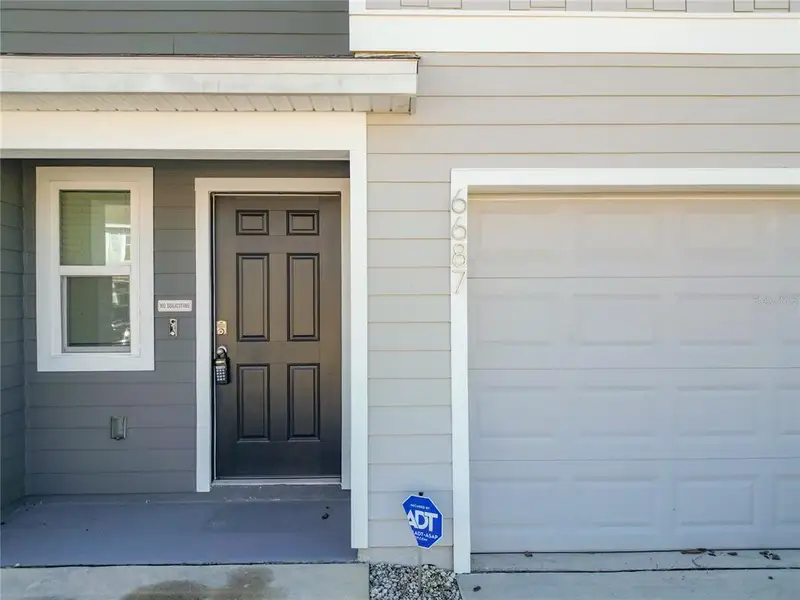 Exterior details and patio area of a home in The Towns at Laurel Commons, Ocala (Image 4).