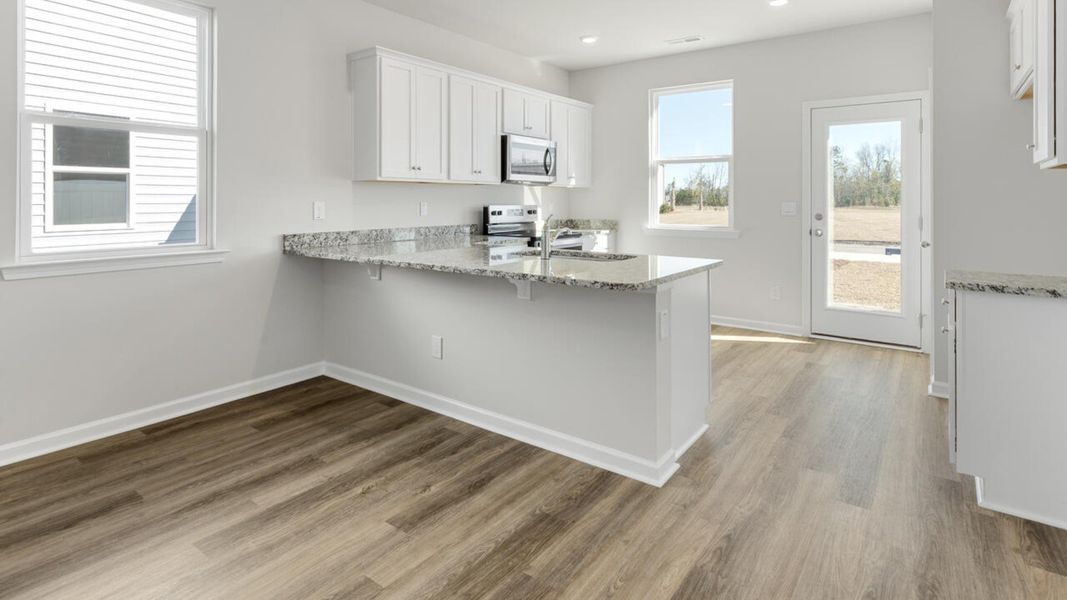 Representative furnished interior of a home built from the PERRY by D.R. Horton in The Cottages at Blake Farm, Wilmington (Image 9).