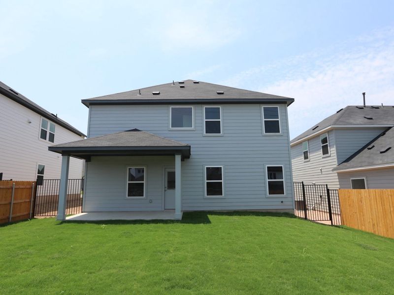 Front exterior of a new home in Cascades at Onion Creek, Austin, TX, highlighting curb appeal (Image 1). Front exterior of a new home in Cascades at Onion Creek, Austin, TX, highlighting curb appeal (Image 1).