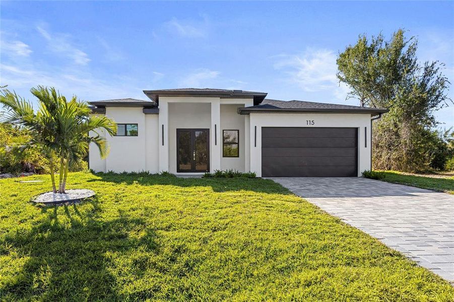 Front exterior of a new home in , Rotonda West, FL, highlighting curb appeal (Image 23).