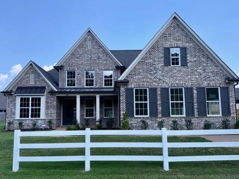 Front exterior of a new home in White Oak, Arlington, TN, highlighting curb appeal (Image 1).