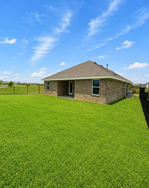 Exterior details and patio area of a home in River Ranch Trails, Dayton (Image 3).