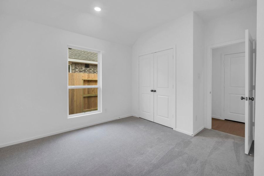 Spacious, unfurnished interior of a new home in Windrose Green: Bristol Collection, Angleton (Image 17).