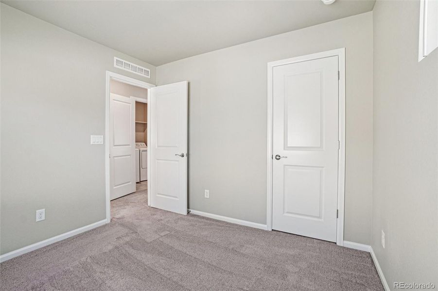 Spacious, unfurnished interior of a new home in Woodrose at Painted Prairie, Aurora (Image 20).