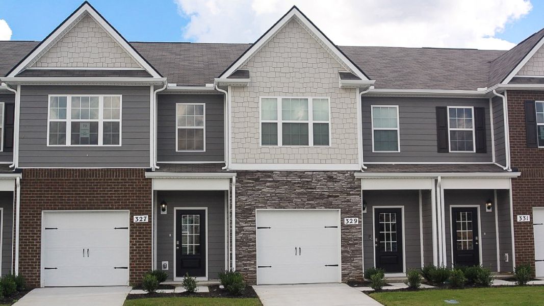 Front exterior of a new home in King's Landing, Lewisburg, TN, highlighting curb appeal (Image 1).