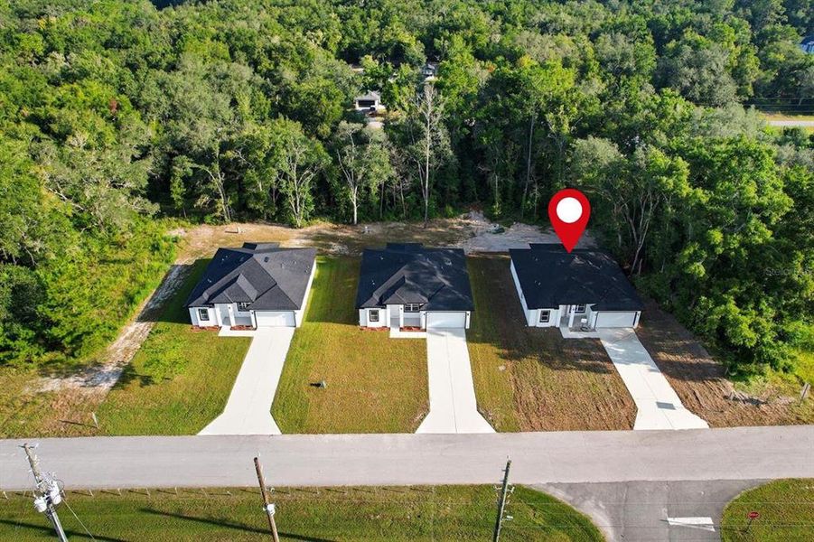 Front exterior of a new home in , Dunnellon, FL, highlighting curb appeal (Image 2).