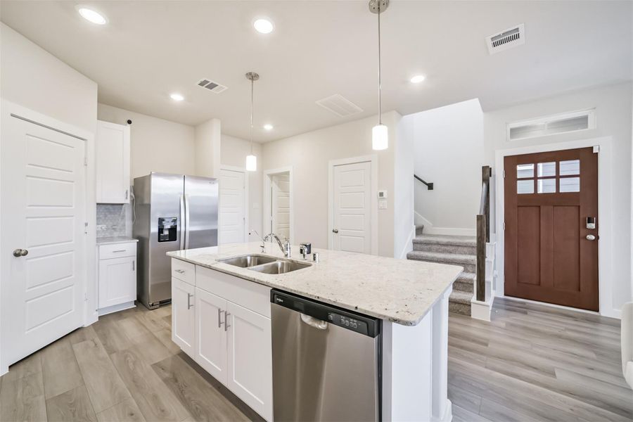 Gleaming stainless steel appliances. Gleaming stainless steel appliances.