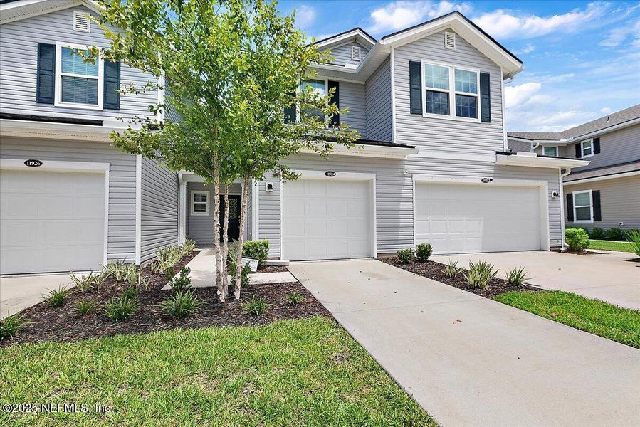 Front exterior of a new home in , Jacksonville, FL, highlighting curb appeal (Image 2).