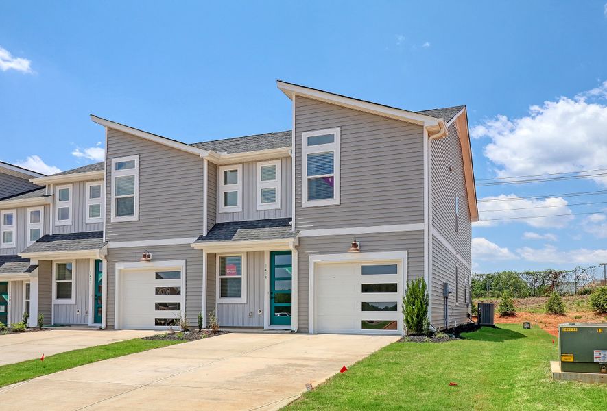 Front exterior of a new home in Westgate Village Townes, Spartanburg, SC, highlighting curb appeal (Image 1). Front exterior of a new home in Westgate Village Townes, Spartanburg, SC, highlighting curb appeal (Image 1).