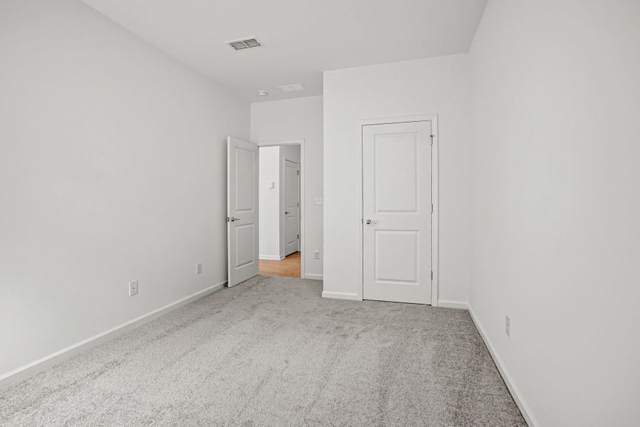 Spacious, unfurnished interior of a new home in Michaux Gardens, Belmont (Image 59).