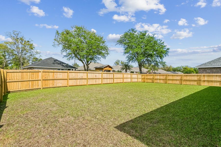 Exterior details and patio area of a home in Buckeyes Landing, Navarre (Image 28).