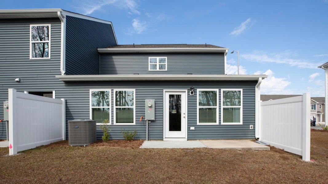 Exterior details and patio area of a home in Waterside Townhomes, Surf City (Image 3).