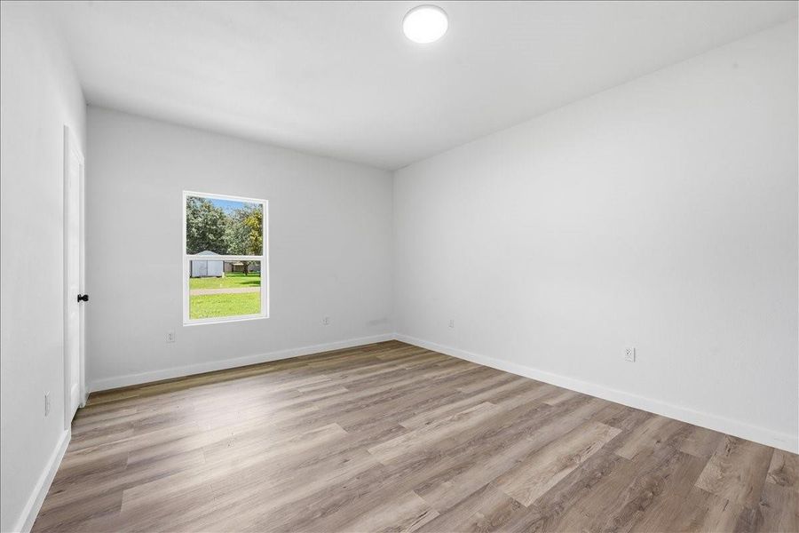 Clean, crisp walls and uniform flooring carry through this additional bedroom space. Clean, crisp walls and uniform flooring carry through this additional bedroom space.