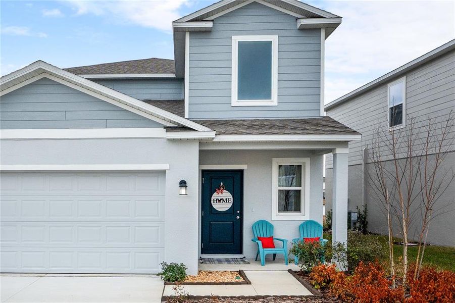 Front exterior of a new home in Preserve at LPGA, Daytona Beach, FL, highlighting curb appeal (Image 2).