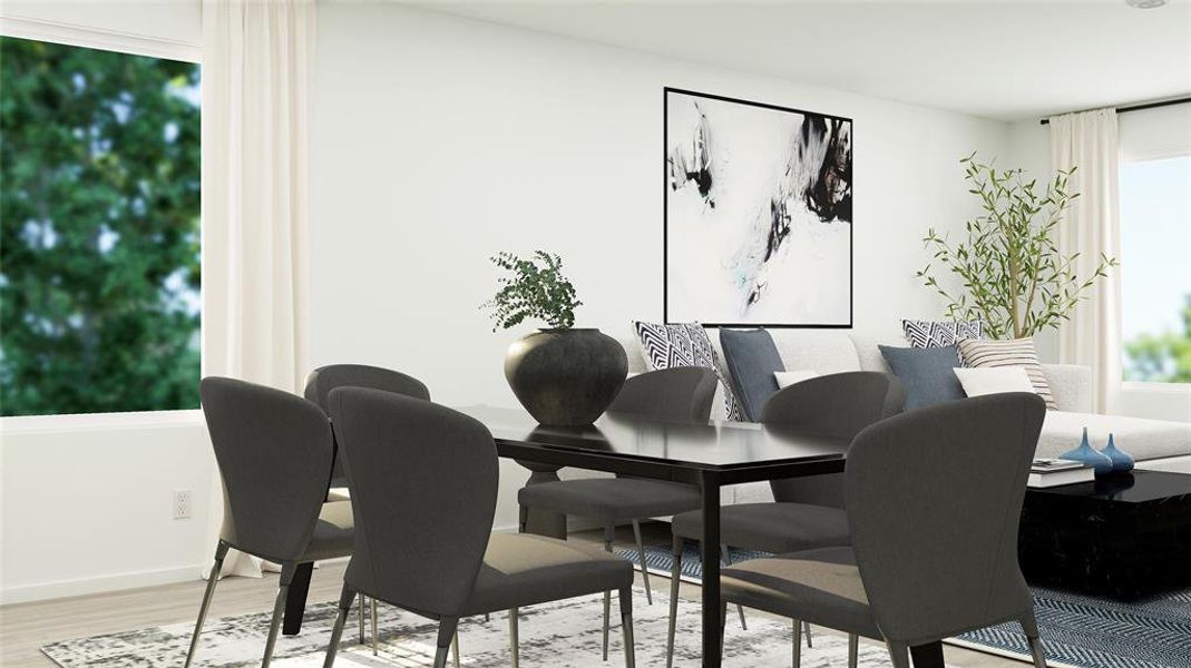 Dining area with light hardwood / wood-style floors