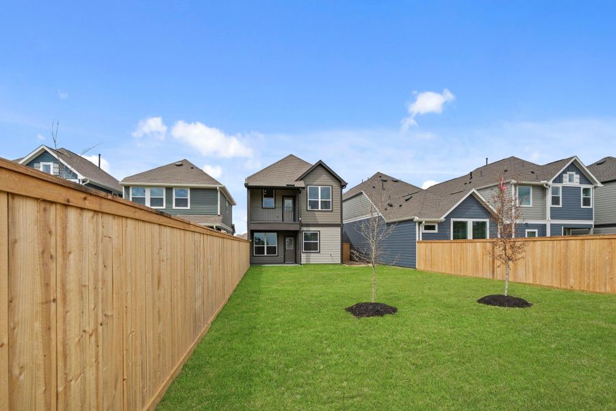 Exterior details and patio area of a home in Bridgeland, Cypress (Image 18).