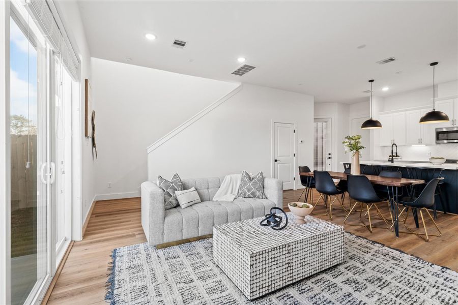 This well-designed floor plan seamlessly connects the living, dining, and kitchen areas, maximizing space and functionality.