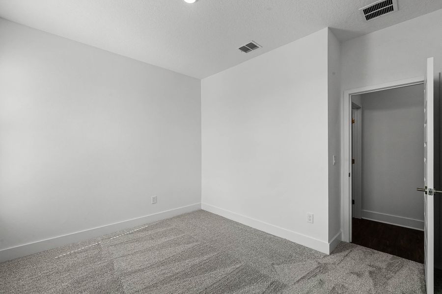 Spacious, unfurnished interior of a new home in Harvest at Ovation - Townhomes, Winter Garden (Image 19).