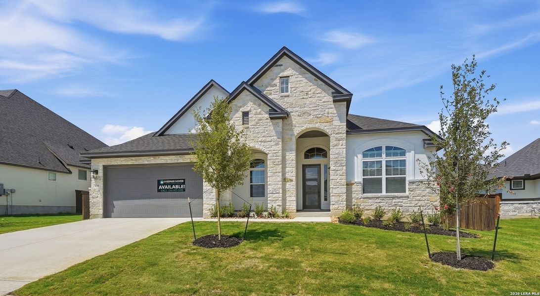 Front exterior of a new home in Mesa Western, Cibolo, TX, highlighting curb appeal (Image 26). Front exterior of a new home in Mesa Western, Cibolo, TX, highlighting curb appeal (Image 26).