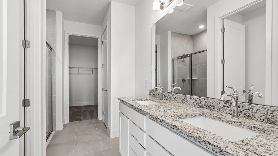 Acacia Floor Plan Primary En Suite Bathroom showcasing Dual Vanity in New Home Community Lakeside at Satilla in St. Cloud, FL Acacia Floor Plan Primary En Suite Bathroom showcasing Dual Vanity in New Home Community Lakeside at Satilla in St. Cloud, FL