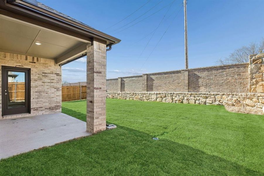 Patio in the Holden home plan by Trophy Signature Homes – REPRESENTATIVE PHOTO
