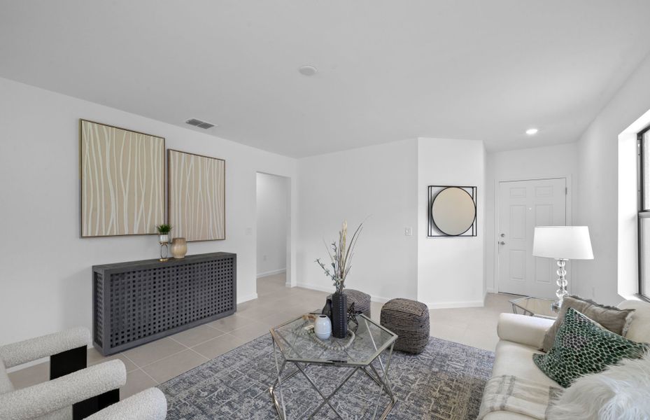 Spacious gathering room flowing into the kitchen and café area