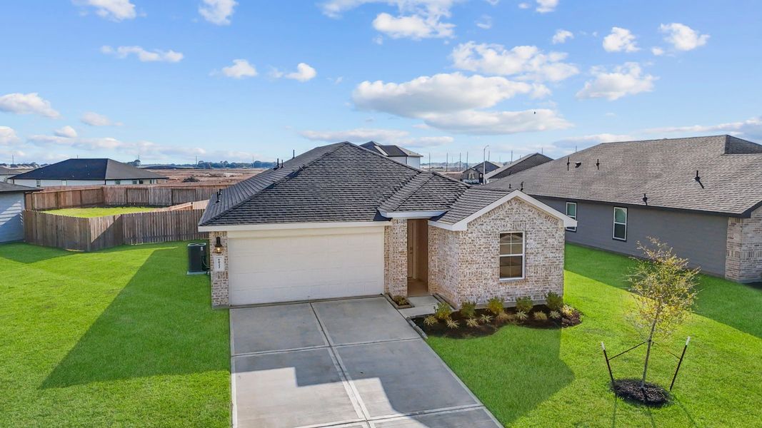 Front exterior of a new home in Tamarron, Fulshear, TX, highlighting curb appeal (Image 26). Front exterior of a new home in Tamarron, Fulshear, TX, highlighting curb appeal (Image 26).