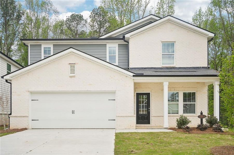 Front exterior of a new home in Westmont Preserve, Powder Springs, GA, highlighting curb appeal (Image 1). Front exterior of a new home in Westmont Preserve, Powder Springs, GA, highlighting curb appeal (Image 1).