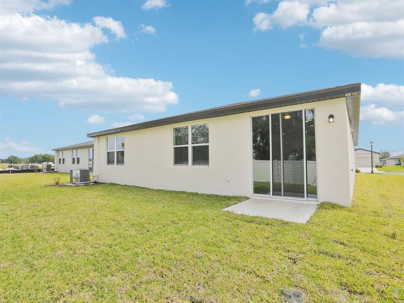 Exterior details and patio area of a home in The Reserve at Van Oaks, Auburndale (Image 23).