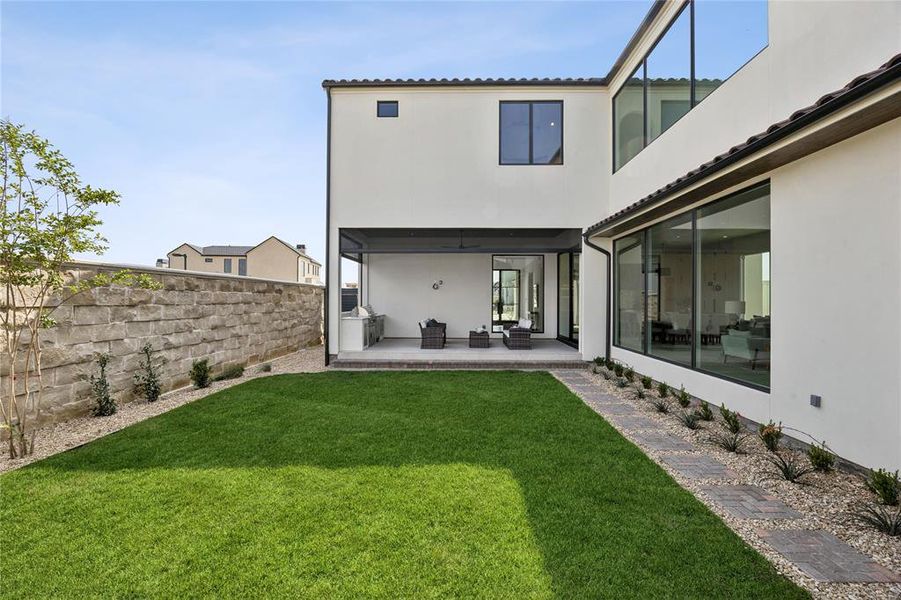 Exterior details and patio area of a home in Avadene at Las Colinas, Irving (Image 25).