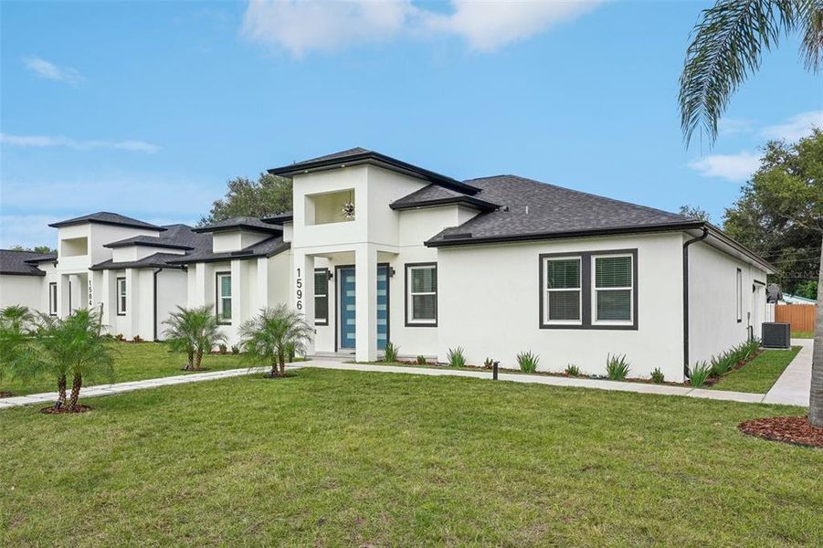 Front exterior of a new home in , Clearwater, FL, highlighting curb appeal (Image 31). Front exterior of a new home in , Clearwater, FL, highlighting curb appeal (Image 31).