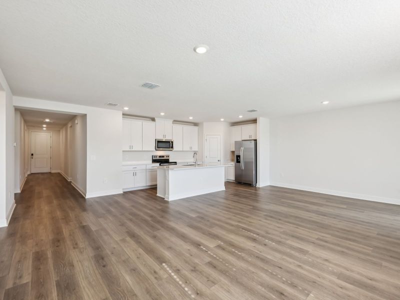 Spacious, unfurnished interior of a new home in The Reserve at Hammock Oaks - Signature Series, Lady Lake (Image 9).