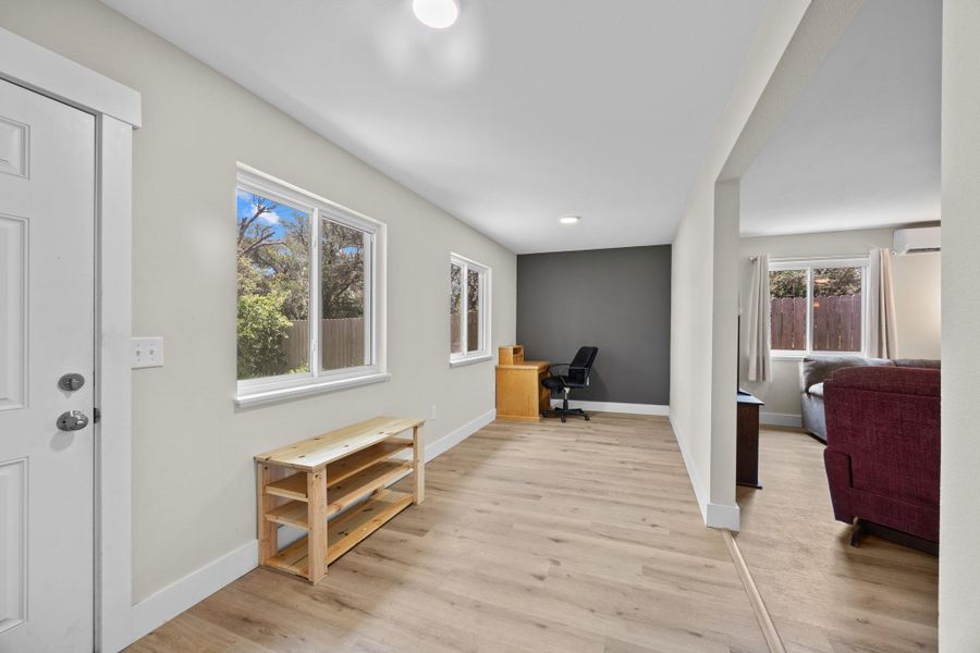 Entrance is perfect as a sunroom or office space,