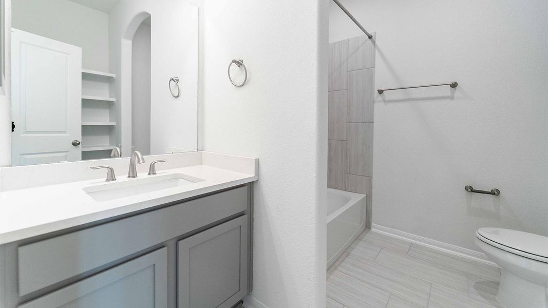 Full bath with vanity and tub / shower combination